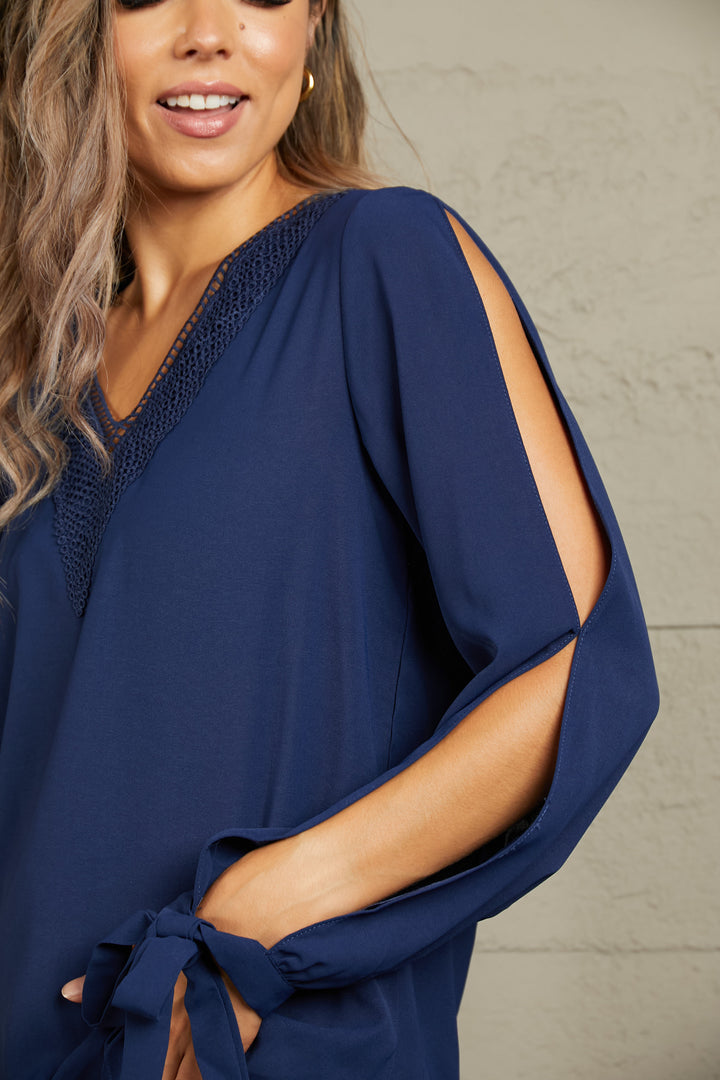 Perfee V-Neck Tie Cuff Slit Blouse | Trendsi