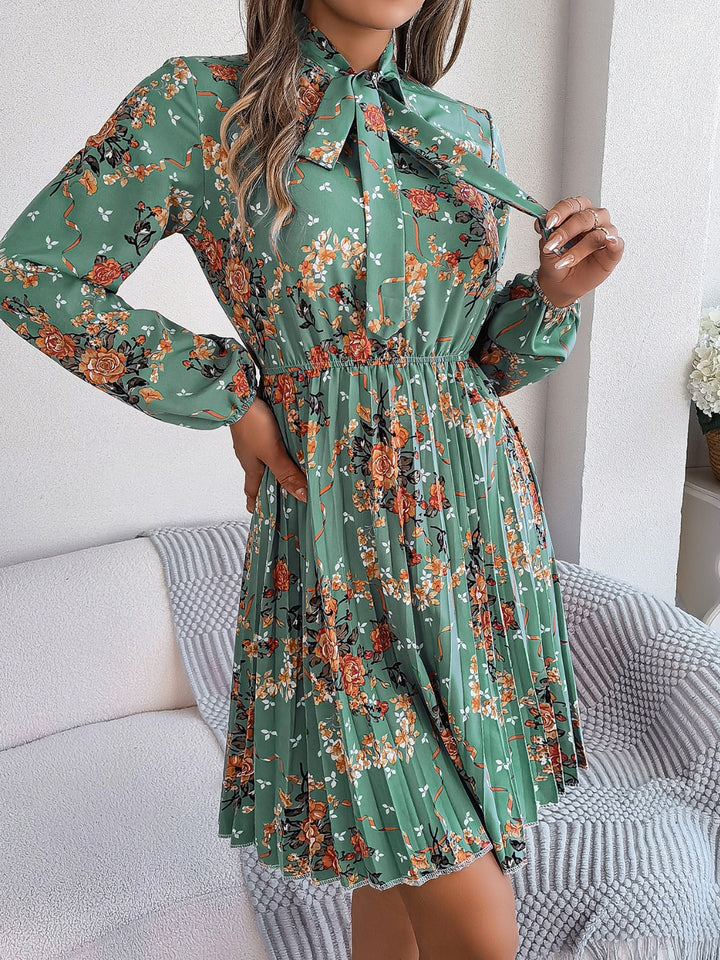 Pleated Printed Tie Neck Long Sleeve Dress | Trendsi