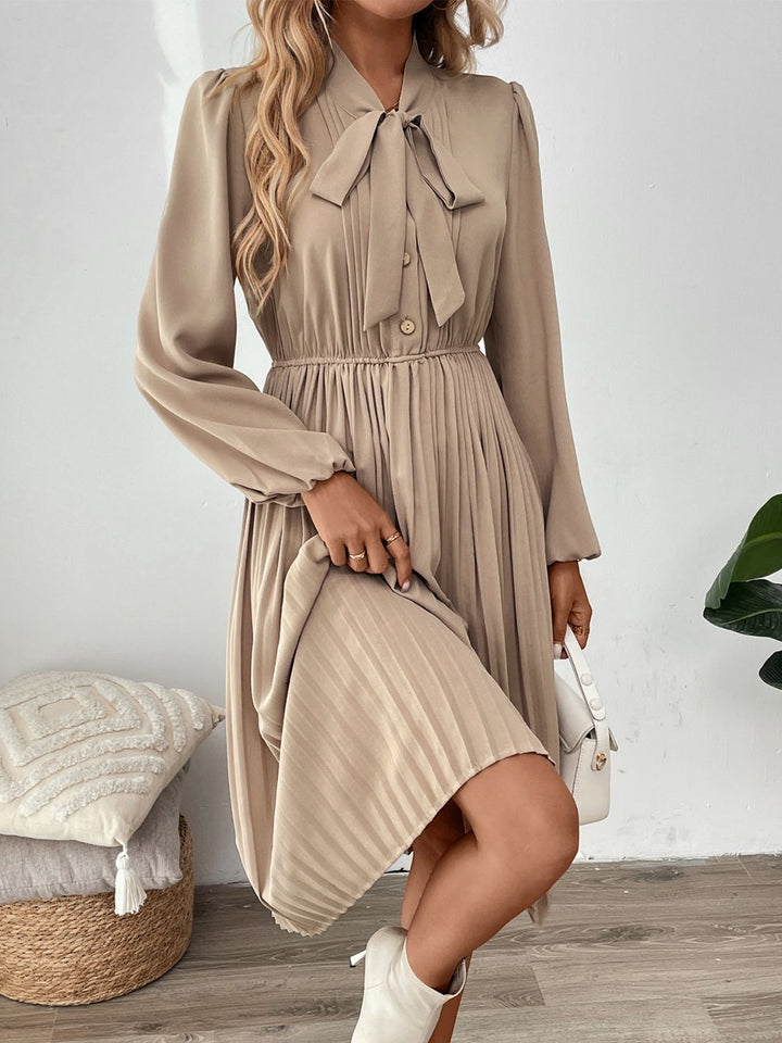 Perfee Pleated Tie Neck Long Sleeve Dress | Trendsi