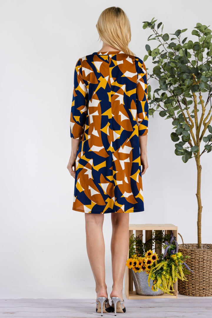 Celeste Full Size Geometric Round Neck Dress with Pockets | Trendsi