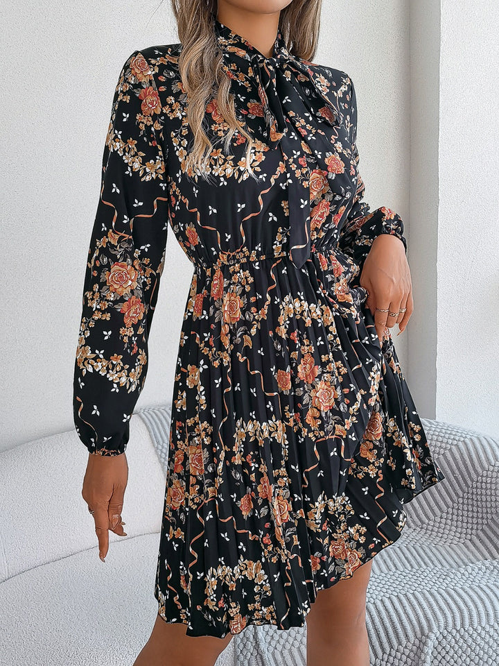 Pleated Printed Tie Neck Long Sleeve Dress | Trendsi