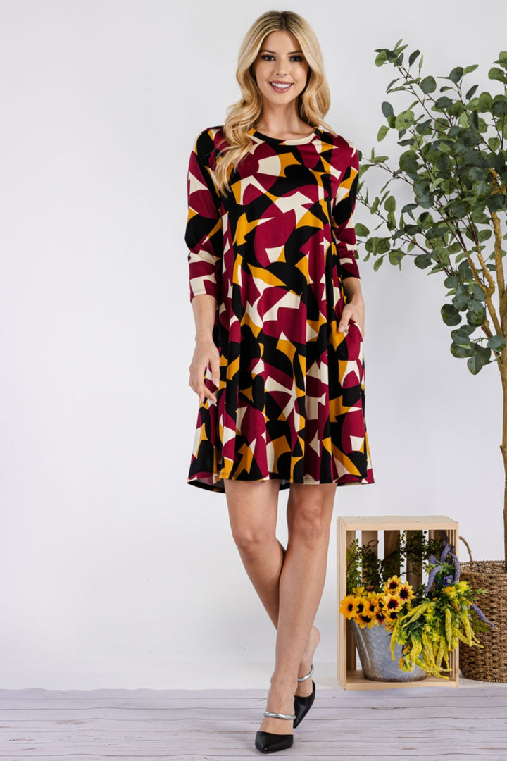 Celeste Full Size Geometric Round Neck Dress with Pockets | Trendsi