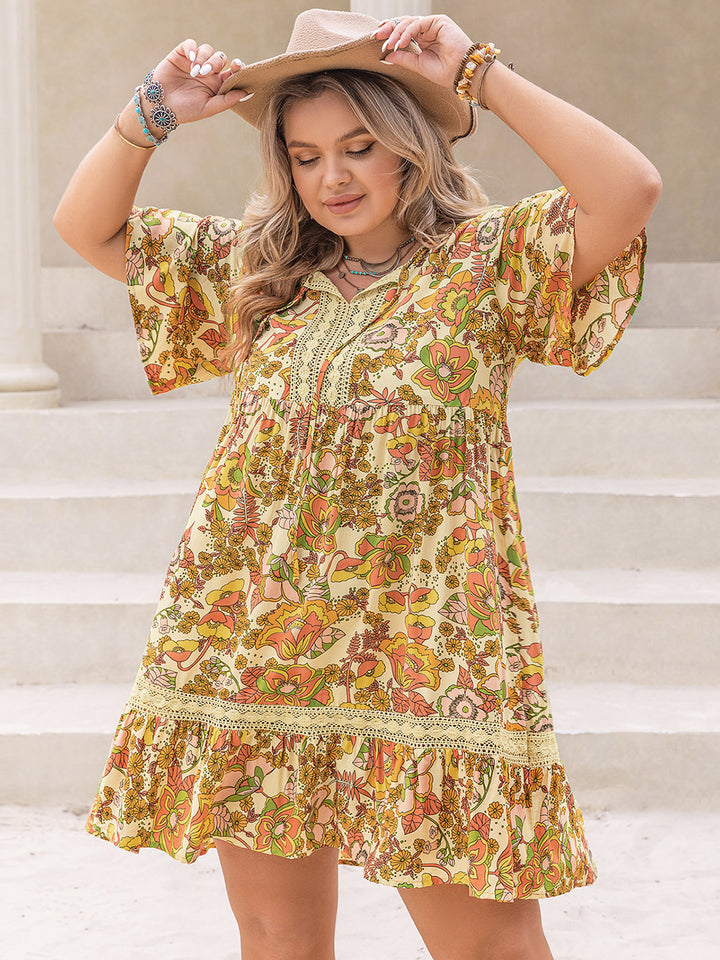 Plus Size Printed Tie Neck Short Sleeve Mini Dress | Trendsi