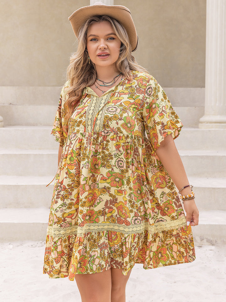 Plus Size Printed Tie Neck Short Sleeve Mini Dress | Trendsi