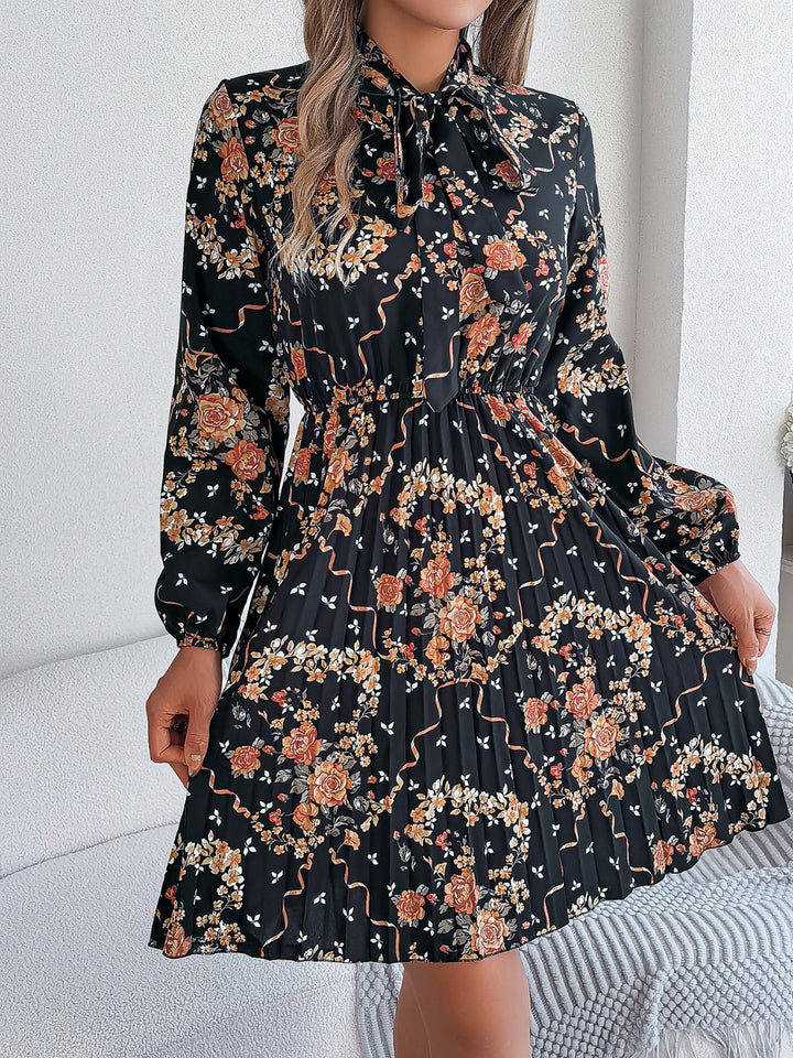 Pleated Printed Tie Neck Long Sleeve Dress | Trendsi