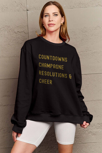 Simply Love Full Size COUNTDOWNS CHAMPAGNE RESOLUTIONS & CHEER Round Neck Sweatshirt | Trendsi