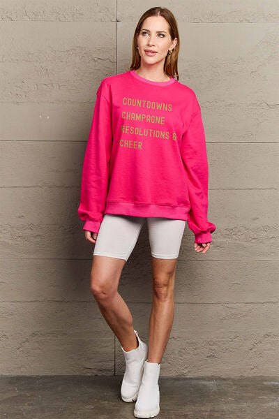 Simply Love Full Size COUNTDOWNS CHAMPAGNE RESOLUTIONS & CHEER Round Neck Sweatshirt | Trendsi