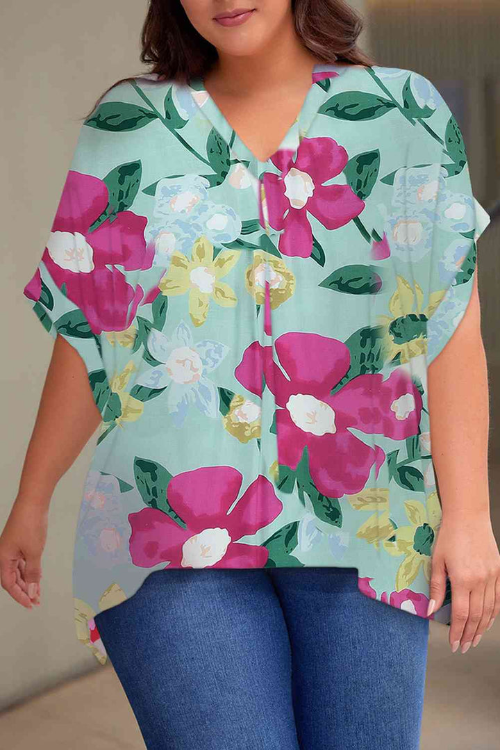 Plus Size Printed Notched Neck Half Sleeve Top | 1mrk.com