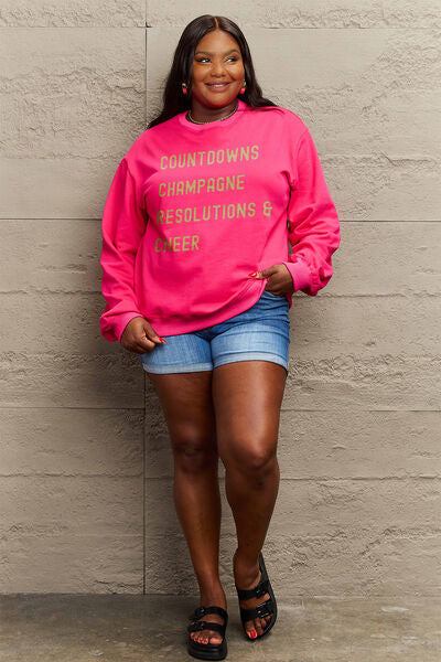 Simply Love Full Size COUNTDOWNS CHAMPAGNE RESOLUTIONS & CHEER Round Neck Sweatshirt | Trendsi