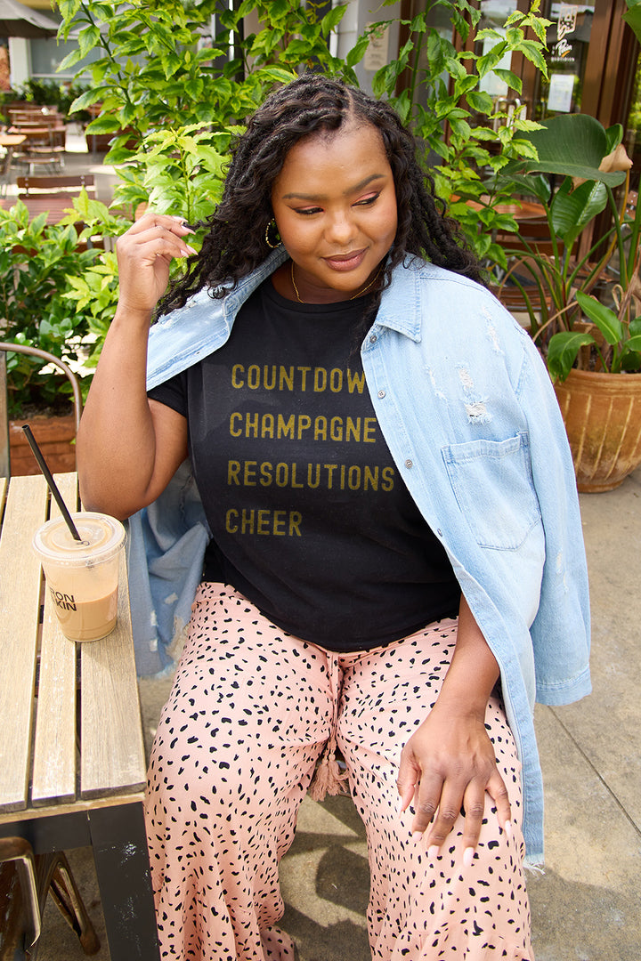 Simply Love Full Size COUNTDOWNS CHAMPAGNE RESOLUTIONS & CHEER Round Neck T-Shirt | Trendsi